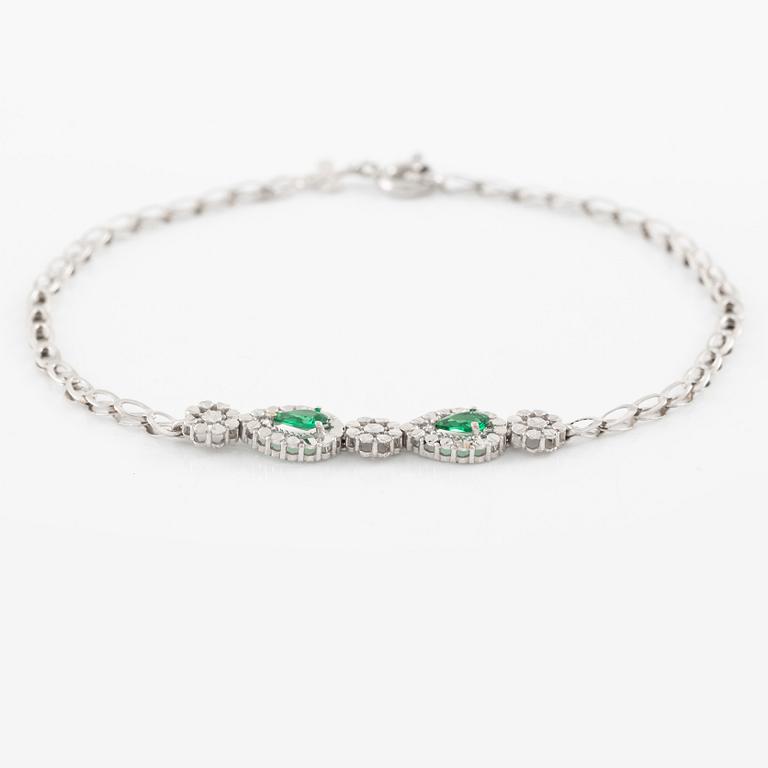 Armband 18K guld med gröna stenar.