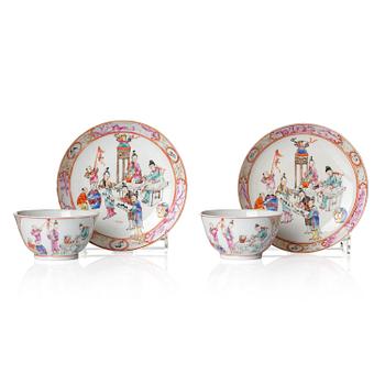 1113. A pair of famille rose 'figural' tea cups with saucers, Qing dynasty, Qianlong (1736-95).