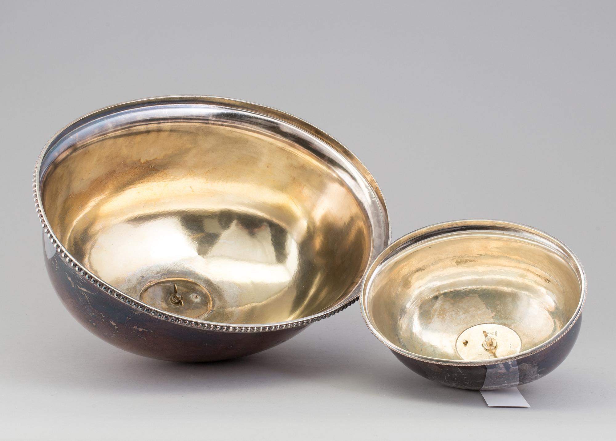 Two silver plated food covers, one by Thomas, New Bond Street, London, England, about 1900.
