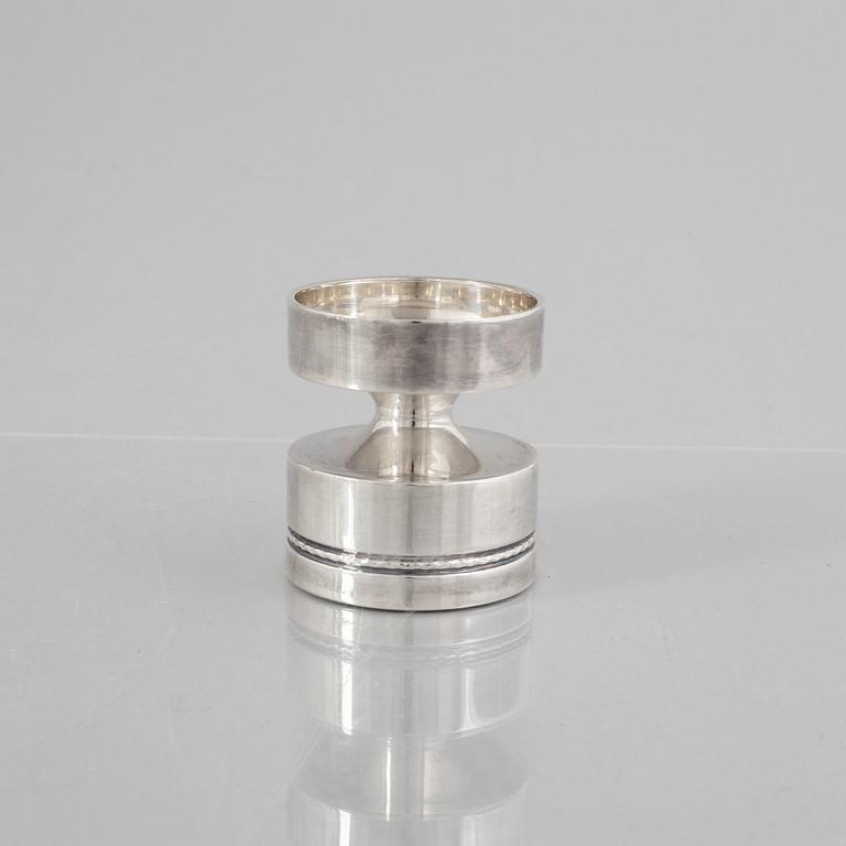 Eric Löfman, a Swedish silver candlestick, a vase and four cups, including MGAB, Uppsala 1977.