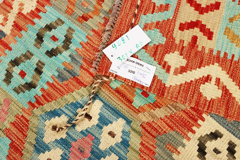 An Afghan kelim runner, c. 301 x 80 cm.