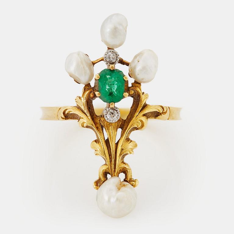 An 18K gold ring set with an emerald, pearls and old-cut diamonds.