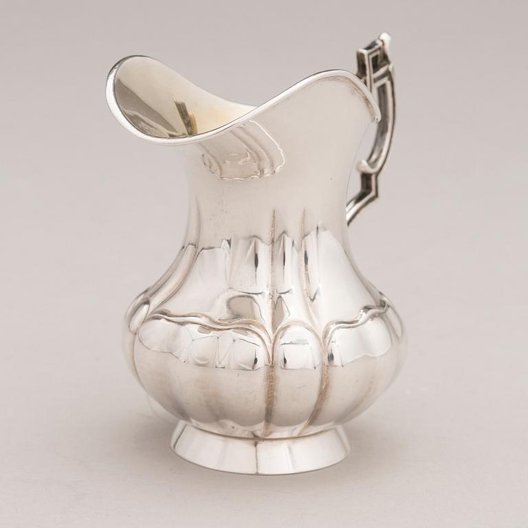 A Russian silver jug, Saint Petersburg, latter half of the 19th Century, cyrillic mark PT.