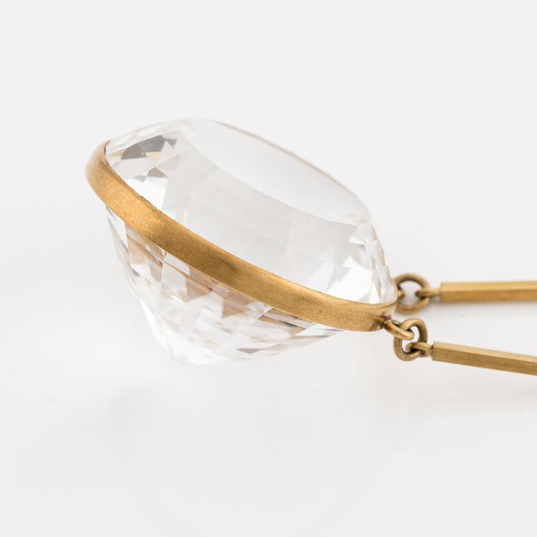 Wiwen Nilsson, an 18K gold necklace with a rock crystal pendant, Lund 1975.