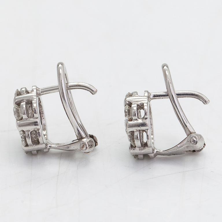 A pair of 18K white gold earrings, with diamonds totalling approximately 0.64 ct.