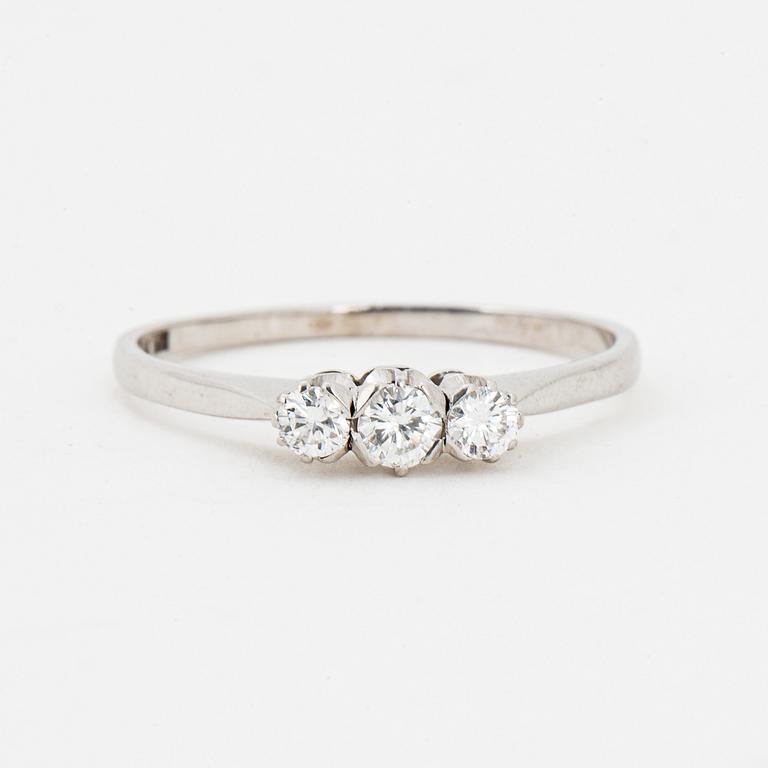 Brilliant-cut diamond three stone ring.