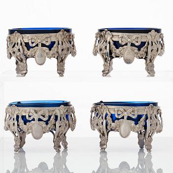 A set of four French silver and blue glass salt-cellars, mark of GA Jacob, Paris 1778.