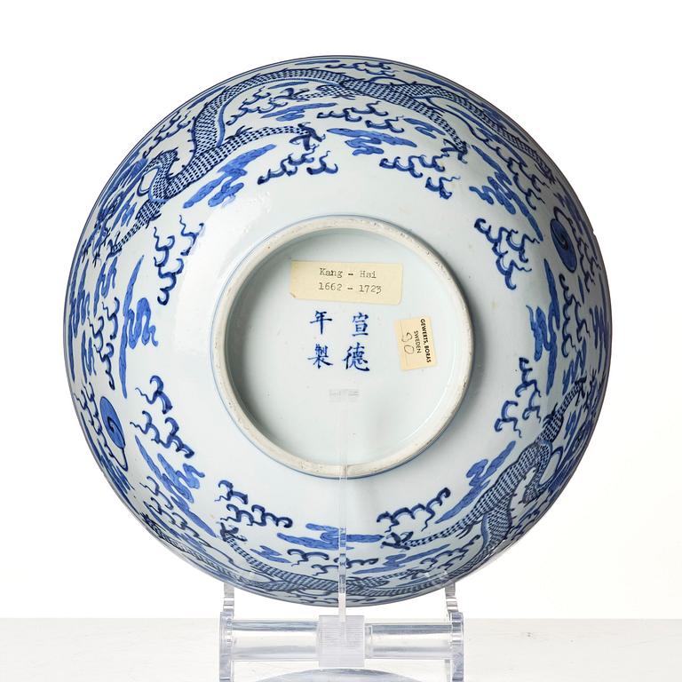 A blue and white four clawed dragon bowl, Qing dynasty with a four character mark of Xuantong (1909-11).