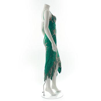 FABRICE, a green silk evening dress with glass bead embellishment.