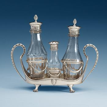 918. BORDSSURTOUT för fyra flaskor, silver, gustaviansk,  Stephan Westerstråhle, Stockholm 1791. Tot vikt ca 1049g.