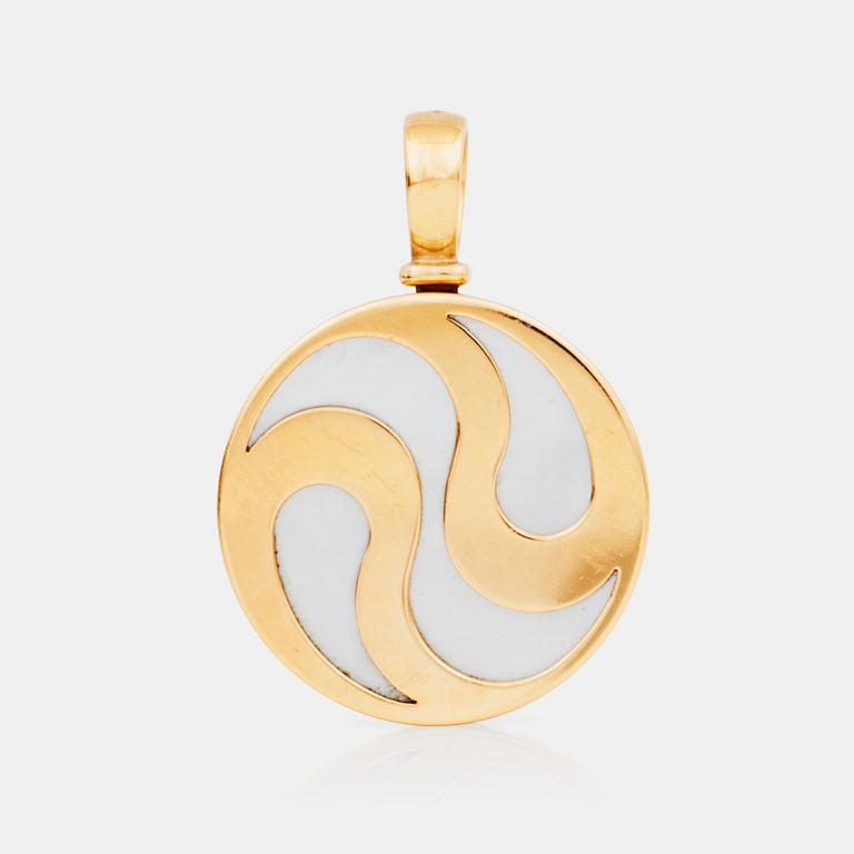 A Bulgari gold and mother of pearl spinning pendant.