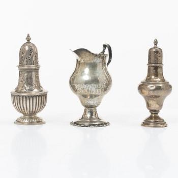 Two silver casters and cream jug, England.