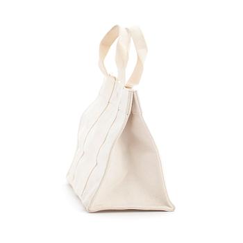 HERMÈS, a white canvas handbag.