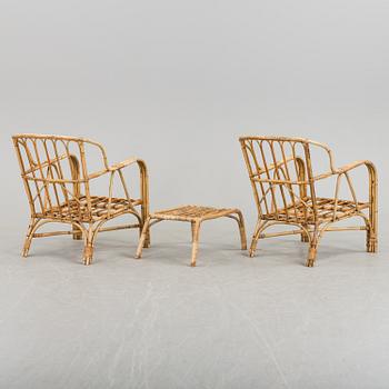 A pair of Garden Armchairs with one stool, mid 20th century.