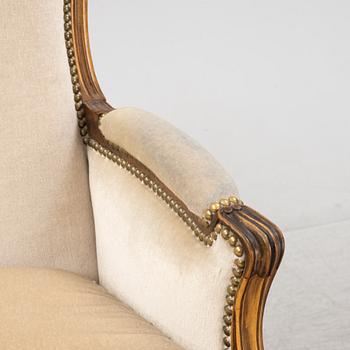 A pair of Louis XV-style lounge chairs, 20th Century.
