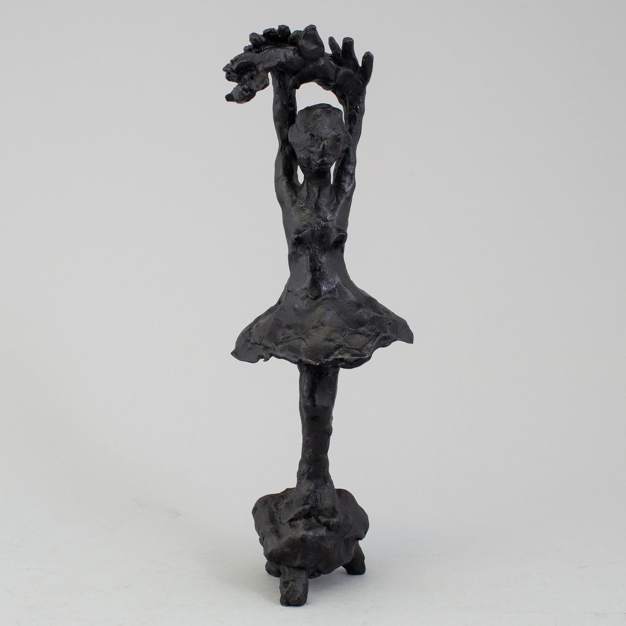 A bronze sculpture by Karin Lind, not signed.