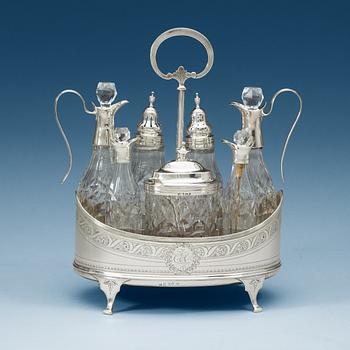 920. An English 18th century silver and glass cruet-set, unidentified makers mark, London 1797.