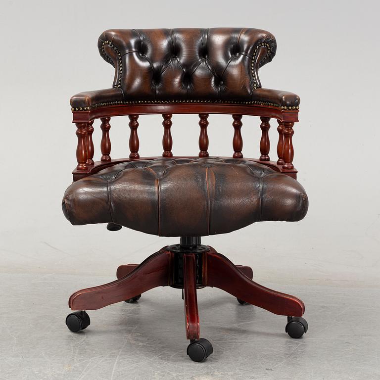 An English mahogany desk chair, 20th Century.