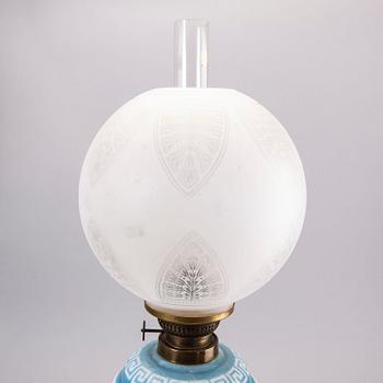 A glass paraffin lamp around 1900.