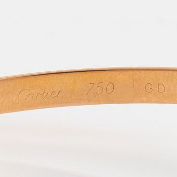 A Cartier "Trinity" bangle.