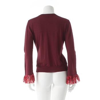 BURBERRY, a burgundy red merino wool cardigan.