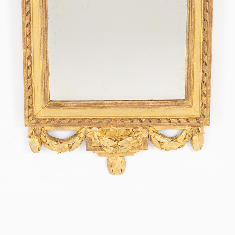 A Gustavian giltwood mirror, Stockholm, late 18th century.