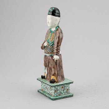 A porcelain figure of a scholar, Qing dynasty, 18th Century.