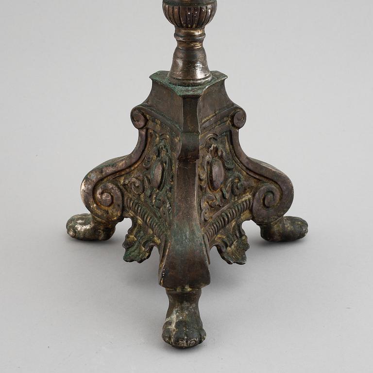 An 18th century bronze candlestick.