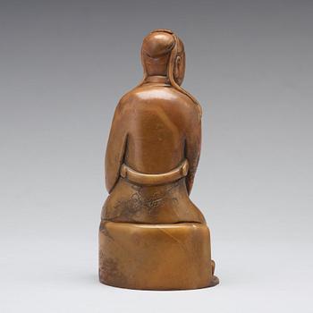 A soapstone sculpture of a mandarin official, late Qing dynasty.