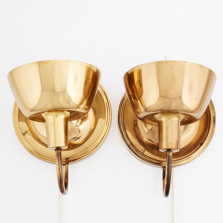 a pair of 'model 2389' wall lights for Svenskt Tenn, Sweden.