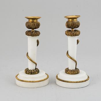 A pair of Louis XVI style candle sticks, circa 1900.