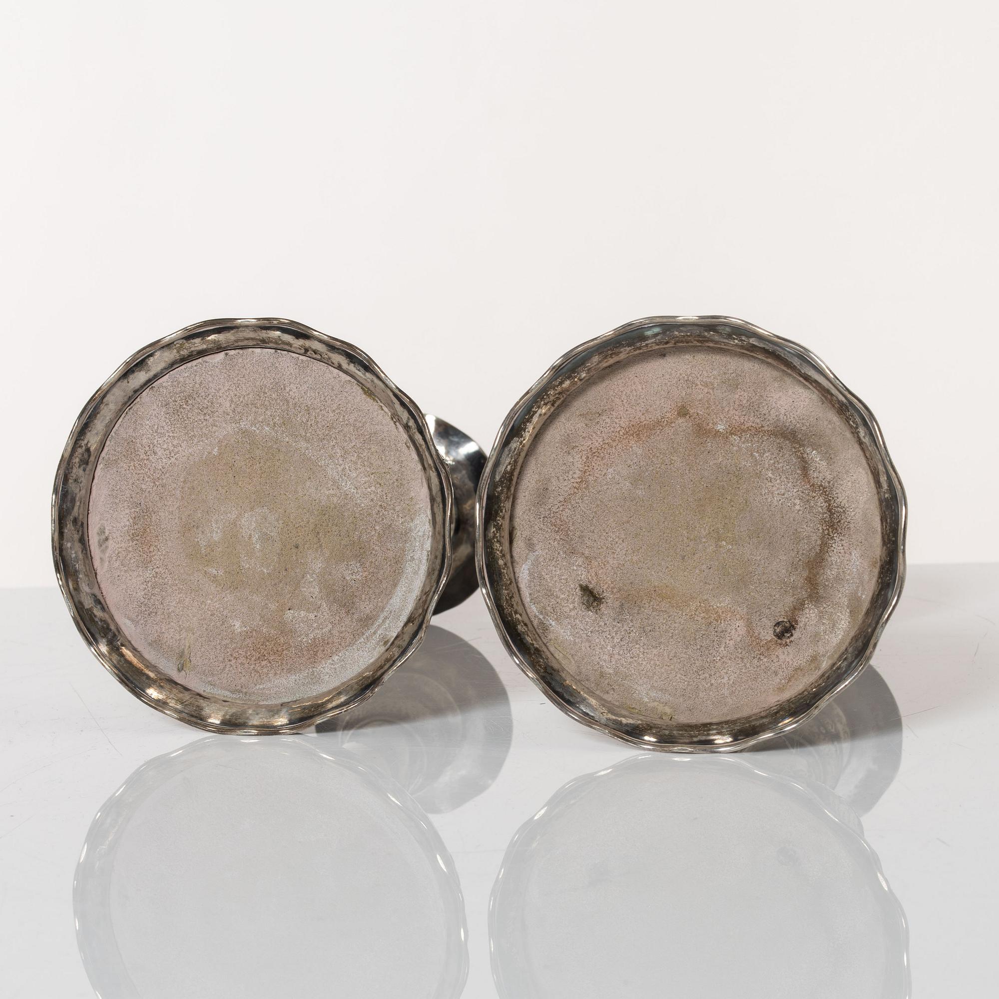 A pair of Baroque style silver candlesticks, marks of CG Hallberg, Stockholm 1942.