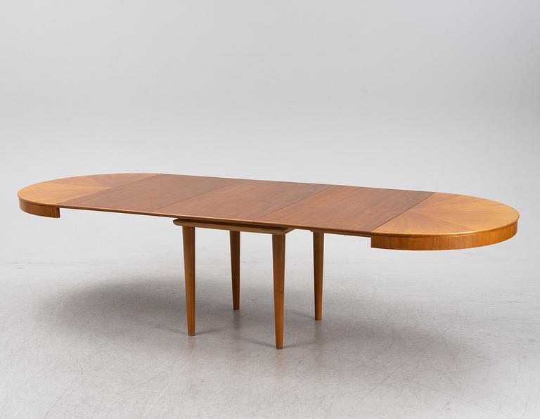 A mahogany veneered Swedish Modern dining table, 1950's.