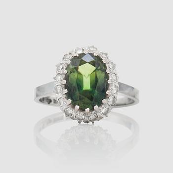 1428. A circa 3.56 ct yellowish-green sapphire and single-cut diamonds, total carat weight circa 0.31 ct.