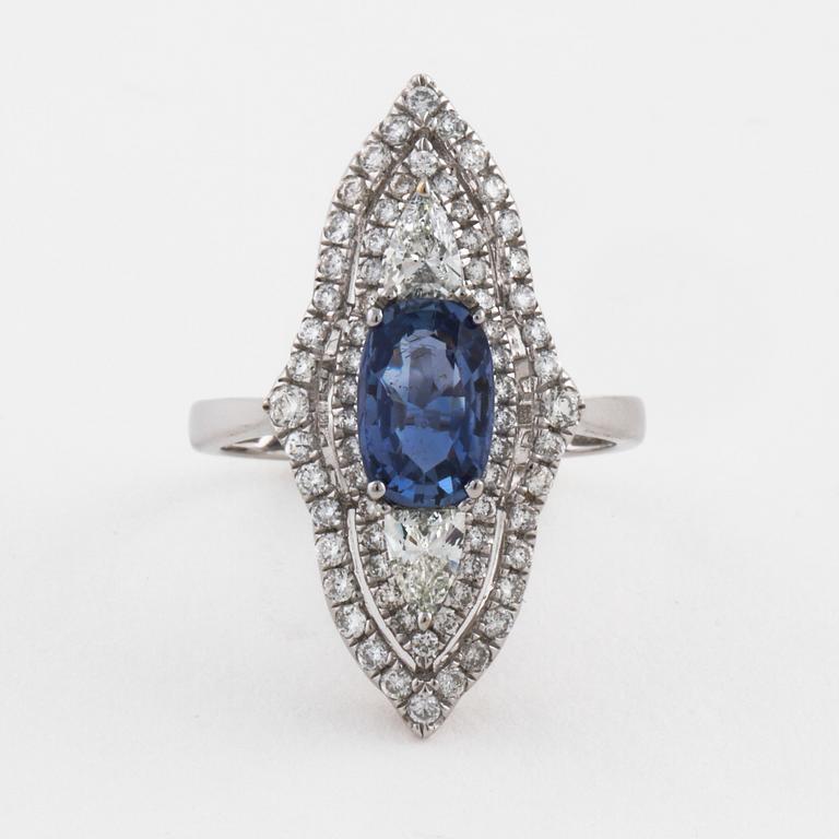 A sapphire and pear- and brilliant cut diamond ring.