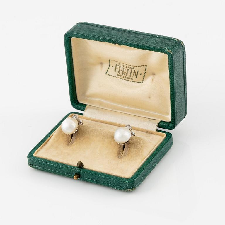 A pair of platinum earrings with bouton pearls and old-cut diamonds.