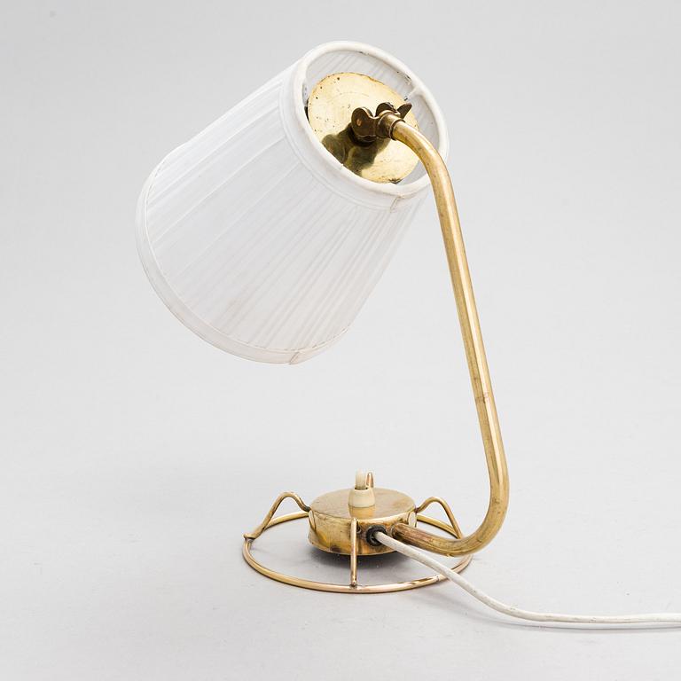 A mid-20th-century table lamp
/wall light for Idman.