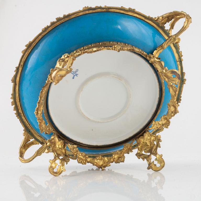 A French porcelain and brass centrepiece, second half of the 19th Century.