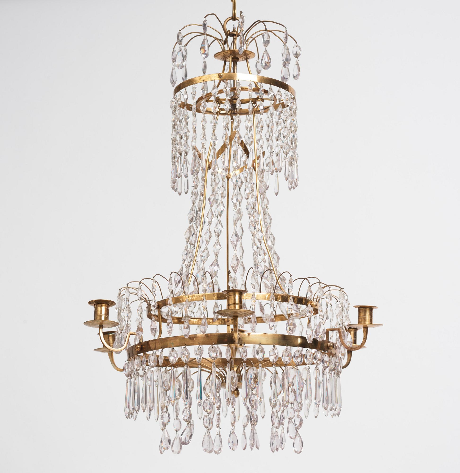 A late Gustavian gilt brass and cut glass seven-branch chandelier, Stockholm, late 18th century.