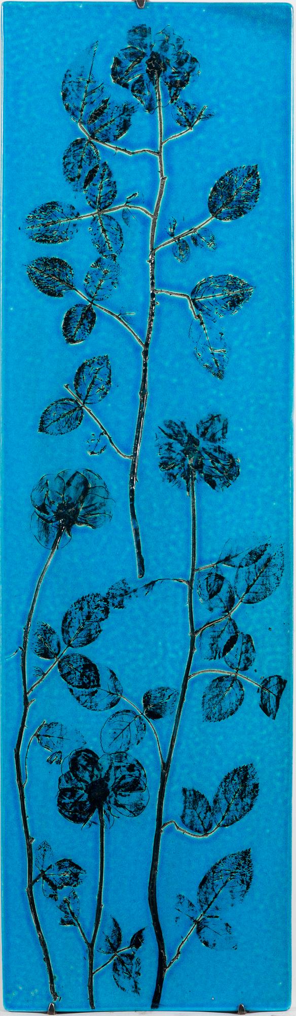 TOINI MUONA, A stoneware relief signed TM Arabia.