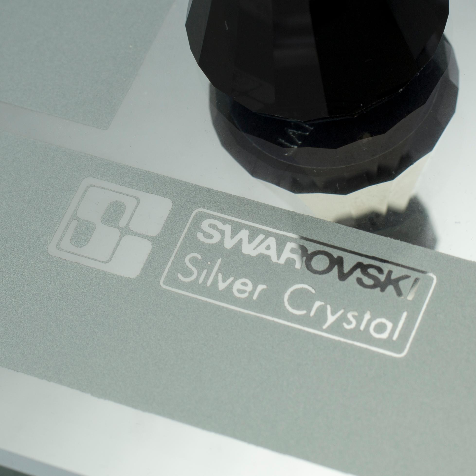 A SWAROVSKI CHESS SET.