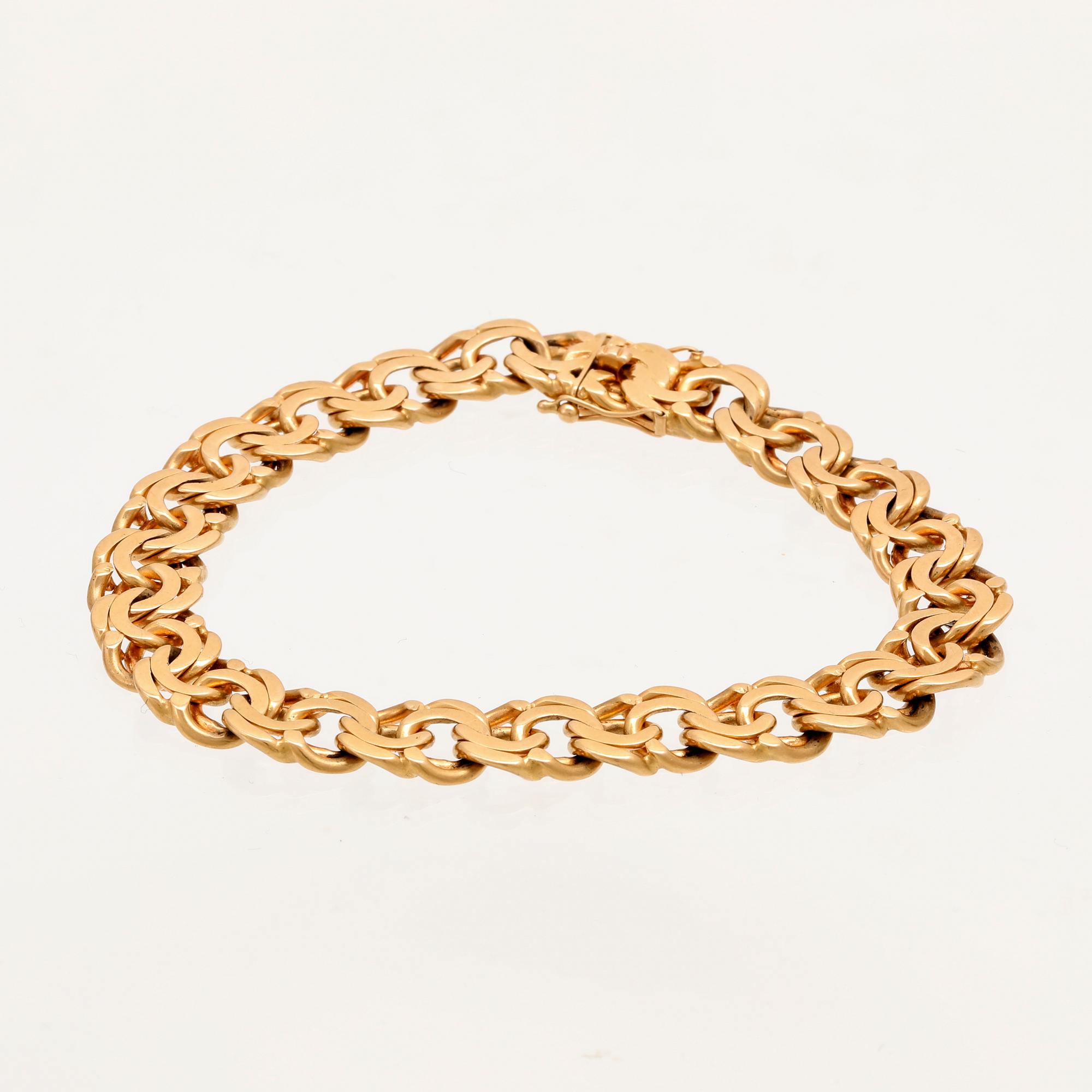 An 18K gold Bismarck bracelet.