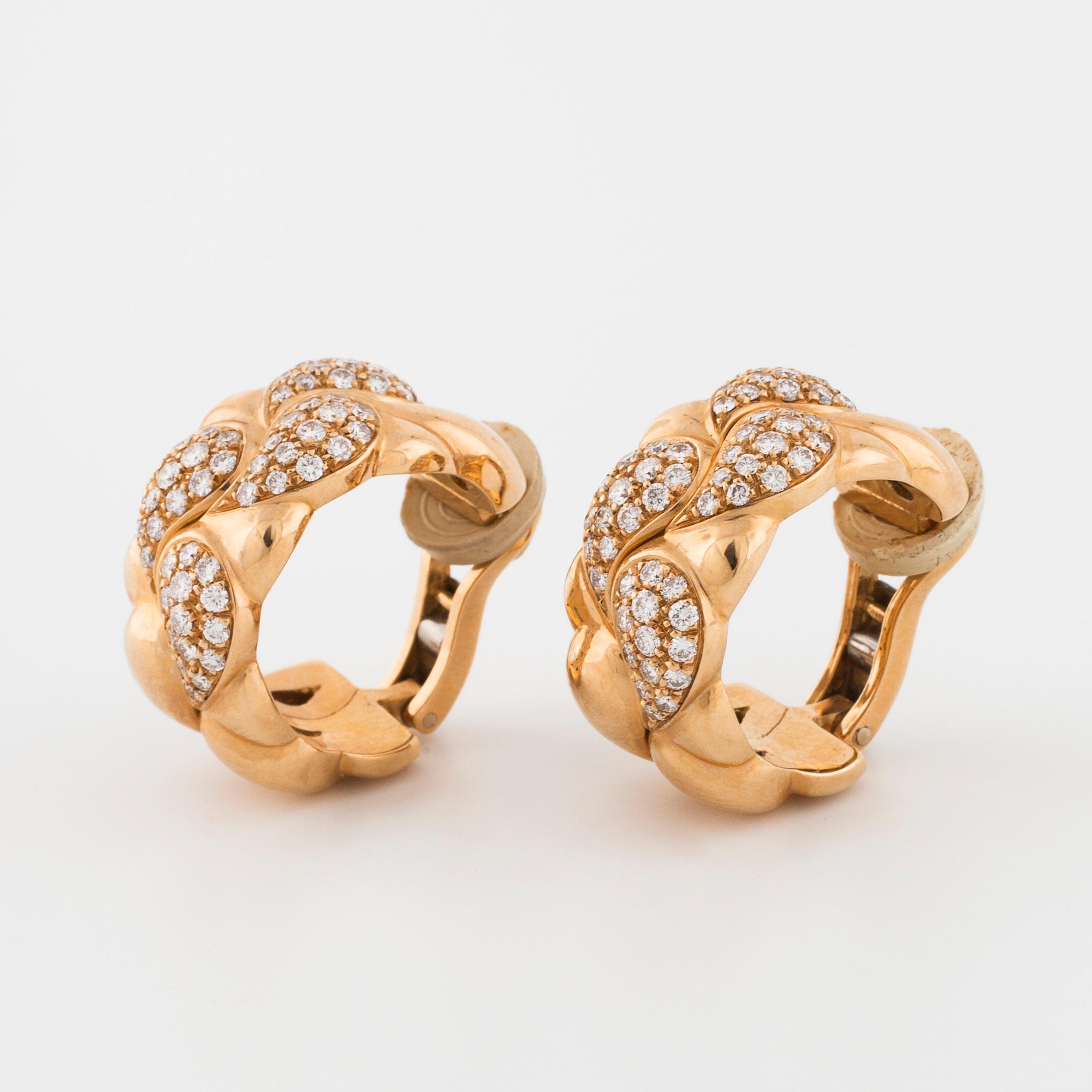 CHOPARD, a pair of "Casmir" earrings set with brilliant cut diamonds.