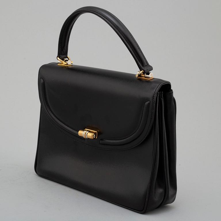 GUCCI, black leather bag.