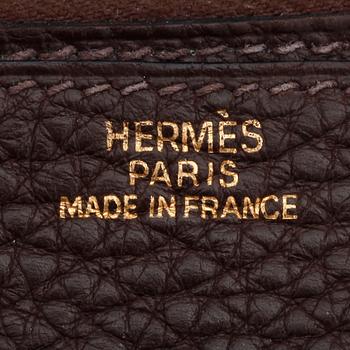 HERMÈS, a brown leather wallet, "Dogon".