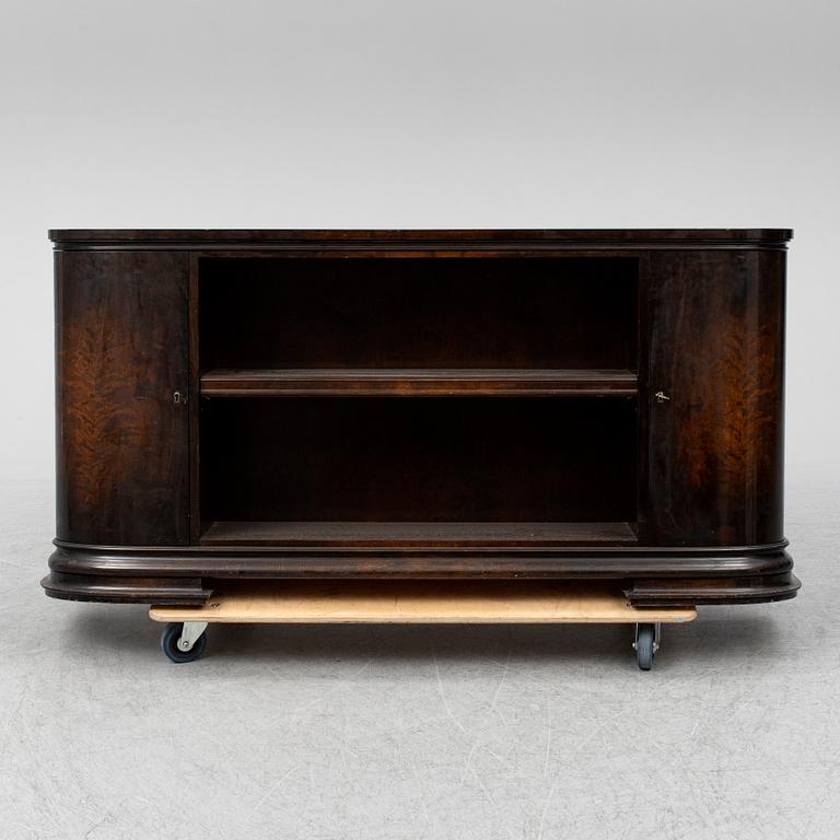 A 1930s stained birch shelf.