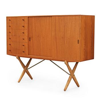 396. Hans J. Wegner, a teak and oak sideboard, cross-shaped legged by Andreas Tuck, Denmark 1950's.