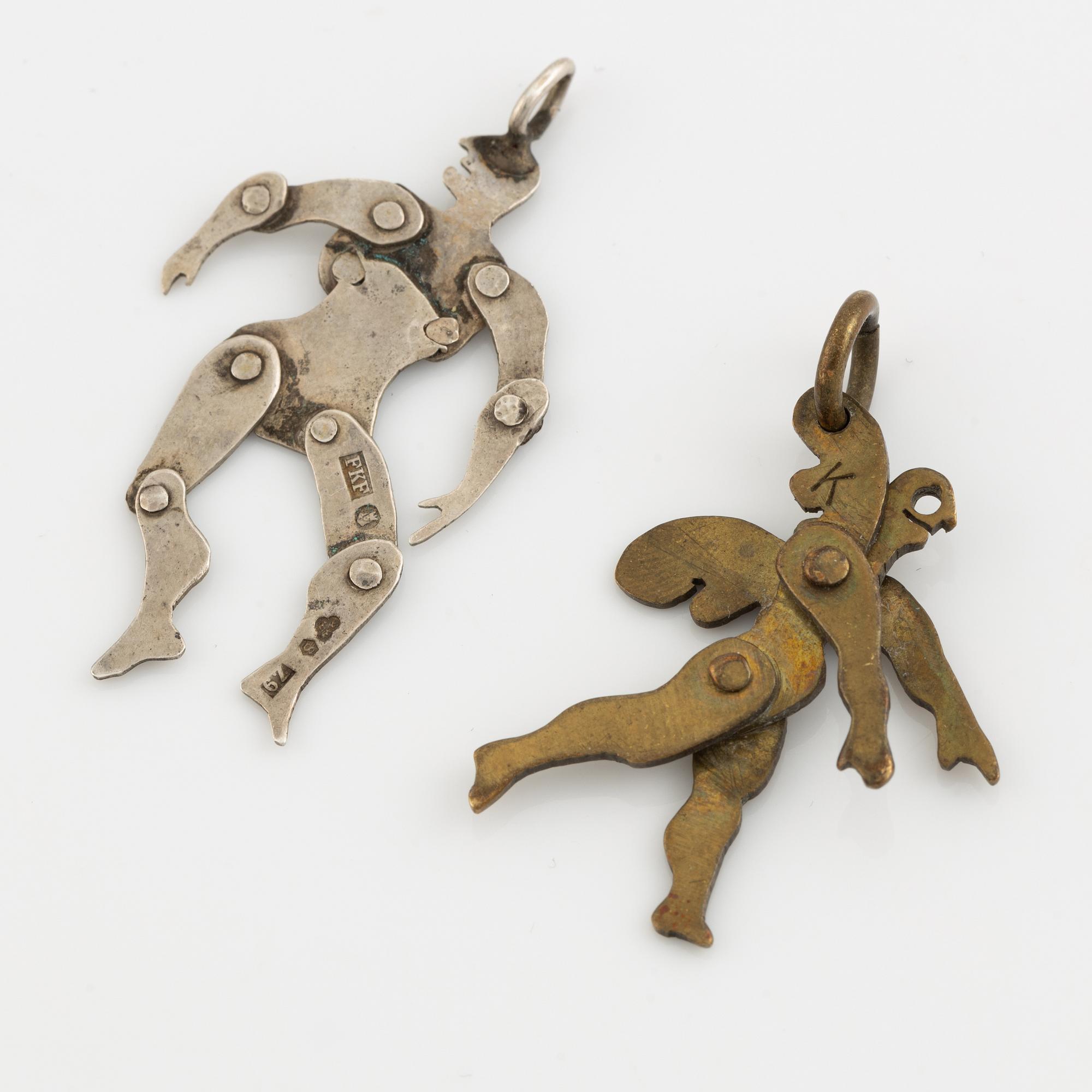 Two pendants, silver and yellow metal.