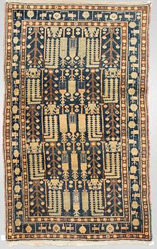 A RUG, a semi-antique West Persian, ca 239-247 x 140,5-147,5 cm (as well as ca 3 cm flat weave at the ends).