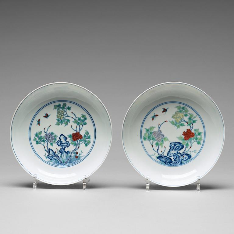 A pair of 'butterfly and peonies' dishes, Qing dynasty with Yongzheng mark.